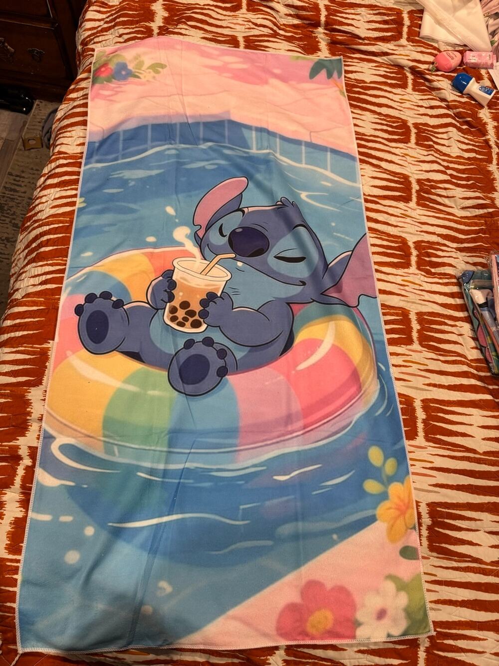 Stitch beach towel Stitch floating in a rainbow inner tube with bubble tea drink